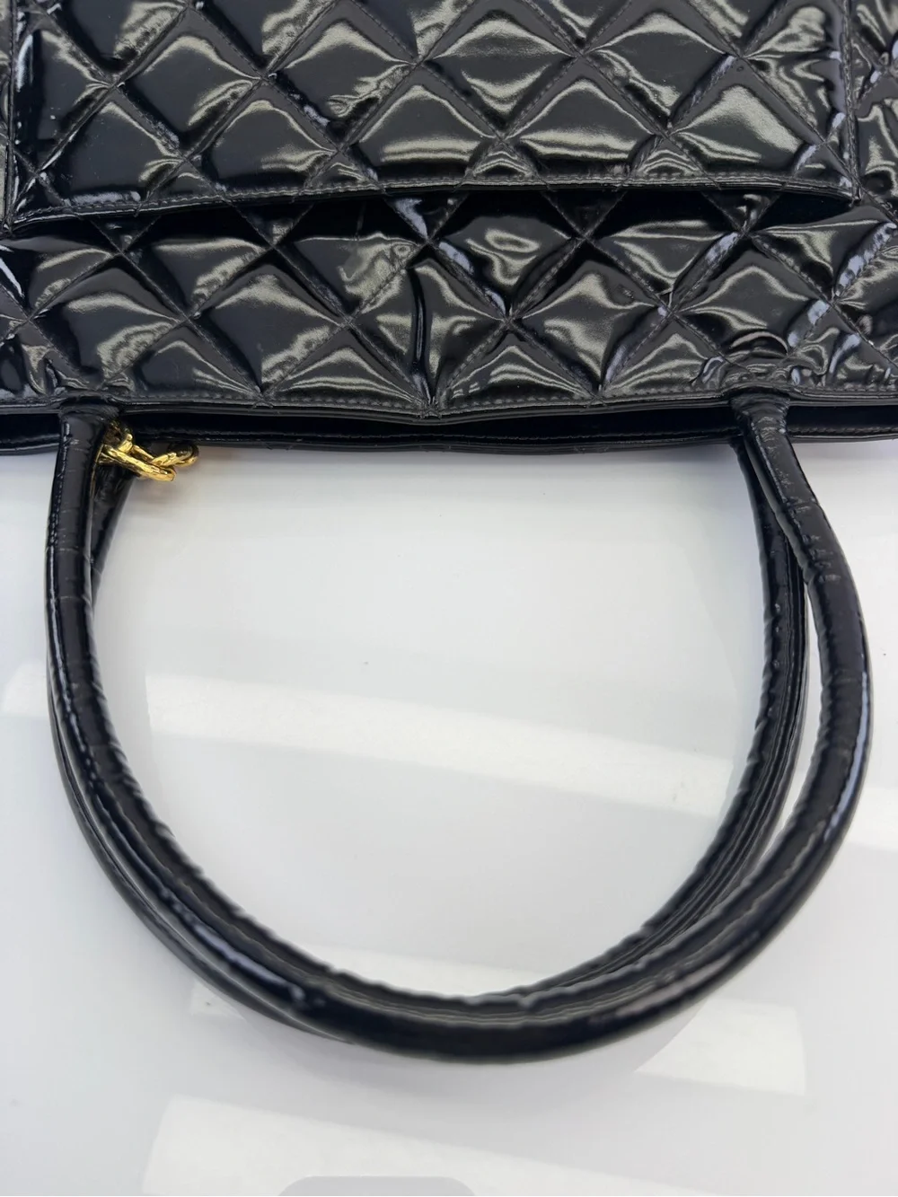 CHANEL Black Quilted Patent Leather Tote with Gold Medallion Charm